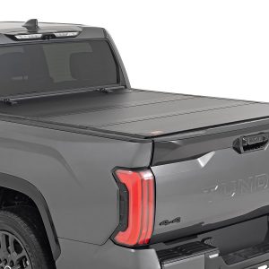 Rough Country Hard Tri-Fold Flip Up Bed Cover 5’7″ Toyota Tundra 2WD/4WD (2022-2026)