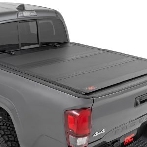 Rough Country Hard Tri-Fold Flip Up Bed Cover 6′ Bed Toyota Tacoma 2WD/4WD (2016-2023)