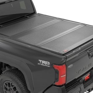 Rough Country Hard Tri-Fold Flip Up Bed Cover 6′ Bed Toyota Tacoma 2WD/4WD (2024-2026)